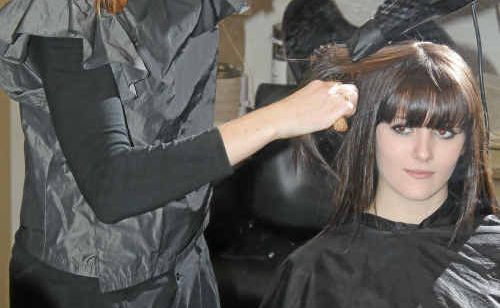Stylist Storm Lahiff puts the finishing touches on model Stormie Owens ahead of the fashion show on August 13. Stylist Storm Lahiff puts the finishing touches on model Stormie Owens ahead of the fashion show on August 13.